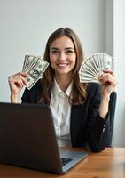 A woman in a business suit holding up money photo