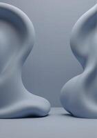Two large white shapes sitting on a gray surface photo