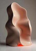 A sculpture made out of a pink and orange material photo