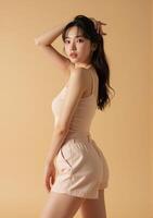 A woman in a pink top and shorts photo