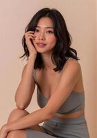 A woman in a grey top and grey shorts photo
