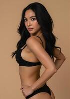A woman in black underwear posing for the camera photo