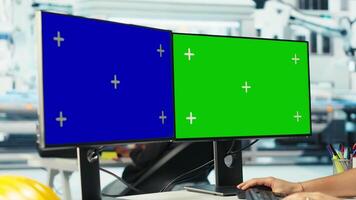 Solar panel plant expert developing new solar energy systems prototypes using green screen computer displays. Man researching new photovoltaics materials using chroma key PC monitors, camera B video