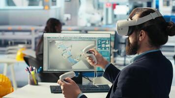 Engineer in photovoltaics factory using virtual reality technology to diagnose malfunctioning systems. Solar panels manufacturing plant worker using VR headset to reduce downtime, camera B video