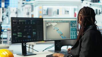 Photovoltaics factory programmer analyzing data with machine learning tech, reviewing system metrics. Solar panels plant developer coding app troubleshooting technical issues, camera B video