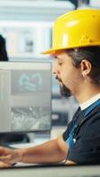 Vertical Photovoltaics factory engineer planning work on facility floor in CAD software, showing team leader. Solar panels manufacturing plant technician designing assembly lines, informing manager, camera B video