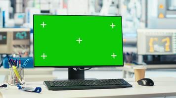 Chroma key mockup computer in empty photovoltaics factory used to diagnose malfunctioning systems. Isolated screen PC in solar panels manufacturing plant used for reducing downtime video