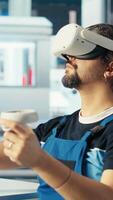 Vertical Photovoltaics factory engineer analyzing data using VR headset, reviewing system health. Solar panels plant employee troubleshooting issues using virtual reality tech, diagnosing faults, camera B video