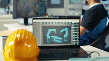 Solar panels manufacturing plant technician uses CAD program to optimize layouts. Photovoltaics factory staff member doing arrangements for maximum renewable energy output, camera B video