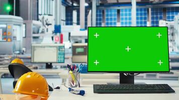 Chroma key PC in solar panels manufacturing plant used to develop new technologies harnessing sun power. Green screen computer in empty photovoltaics factory used to improve efficiency video
