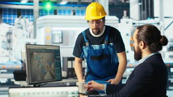Solar panels plant expert sharing findings with engineer after developing new technologies harnessing sun power. Photovoltaics factory researcher telling worker how to improve efficiency, camera B video