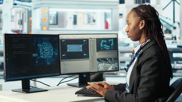 Photovoltaics factory programmer using AI technology to monitor system performance. Solar panels manufacturing plant developer using artificial intelligence to track energy production, camera B video