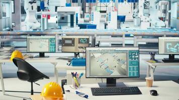 PC display used to adjust empty photovoltaics facility system parameters, increasing performance. Computer desk in solar cells manufacturing plant optimizing energy supply, dolly in shot video