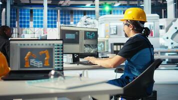 Solar panels plant engineer using PC to study energy systems and learn how to harness sun power. Photovoltaics factory staff member using computer to improve development efficiency, camera A video