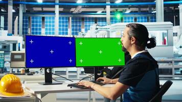 Solar panels plant expert using isolated screen PC to develop new technologies harnessing sun power. Photovoltaics factory engineer works on mockup computer to improve efficiency, camera A video