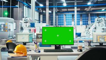 Chroma key PC in empty solar panel manufacturing plant used for developing new solar energy systems prototypes. Green screen computer monitor used for researching new photovoltaics materials video
