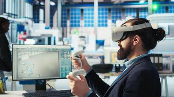 Photovoltaics factory expert using VR tech to build models of renewable energy generators. Solar panels plant technician building environmentally safe solar cells using virtual reality gear, camera A video
