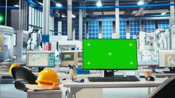 Chroma key mockup computer in empty photovoltaics factory used to diagnose malfunctioning systems. Isolated screen PC in solar panels manufacturing plant used for reducing downtime video