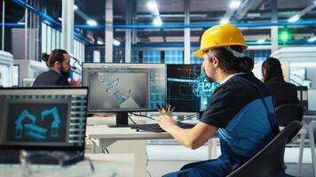 Photovoltaics factory engineer uses artificial intelligence to diagnose malfunctioning systems. Solar panel manufacturing plant worker uses AI tech to maintain system operational reliability, camera A video