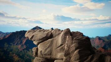 Panoramic view of a stunning mountain range with rocky terrain in the foreground. Perfect for adventure seekers looking for an extreme hiking experience in the heart of untouched wilderness. video