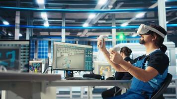 Photovoltaics factory engineer analyzing data using VR headset, reviewing system health. Solar panels plant employee troubleshooting issues using virtual reality tech, diagnosing faults, camera A video