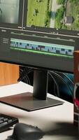 Vertical Male editor working on creative software to create montage, using color correction and adding visual effects. Content creator editing graphics and gradient for movie post production. Camera B video