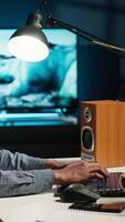 Vertical Financial advisor talks to his team on phone call at home office, obtain new business funding from shareholders. Young man doing remote work to increase revenue and reduce cost. Camera B. video