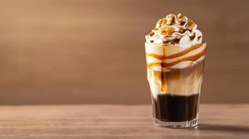 An iced coffee with caramel and whipped cream photo