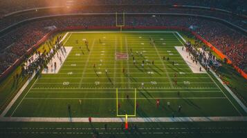 Aerial view of a football field during a game with spectators and players present photo