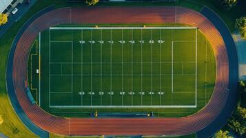 Aerial view of a well-maintained sports field with a running track photo