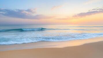 A serene beach at sunset, with gentle waves lapping against the shore photo