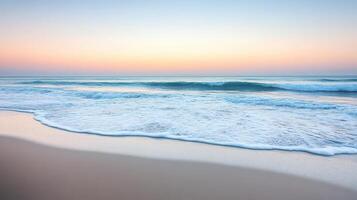 A serene beach scene at dawn with gentle waves and a pastel sky photo