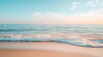 A serene beach scene with gentle waves and a calm sky at sunset photo