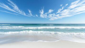 A serene beach scene with gentle waves and a clear blue sky photo