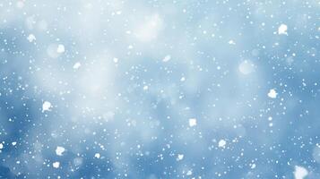 A serene winter scene with softly falling snowflakes against a blue background photo
