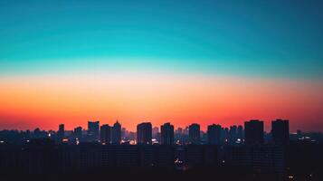 A vibrant skyline at sunset with silhouettes of buildings against a colorful sky photo