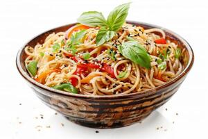 A bowl of colorful noodle salad garnished with herbs and sesame seeds photo