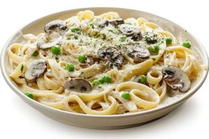 A plate of creamy fettuccine pasta with mushrooms and peas, garnished with cheese photo