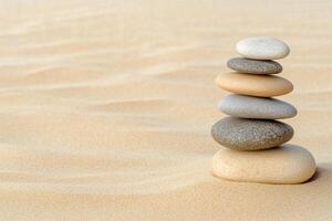 A stack of stones in the sand photo