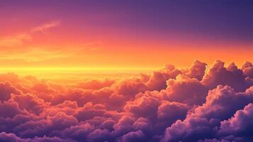A breathtaking sunset over fluffy clouds, showcasing vibrant colors in the sky photo