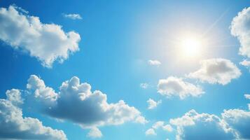 A bright blue sky filled with fluffy white clouds and a shining sun. photo