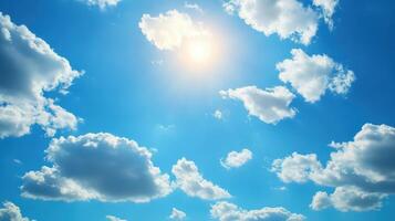 A bright blue sky with fluffy clouds and sunlight shining through photo