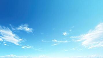 A clear blue sky with scattered clouds, evoking a sense of tranquility and openness photo