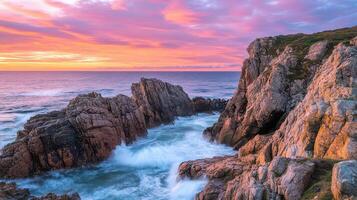 A stunning coastal landscape at sunset with rocky formations and crashing waves photo