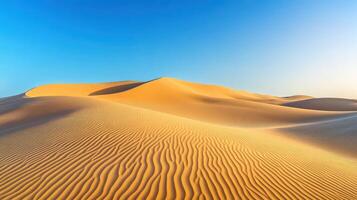 A tranquil desert landscape with gentle sand dunes under a clear blue sky photo