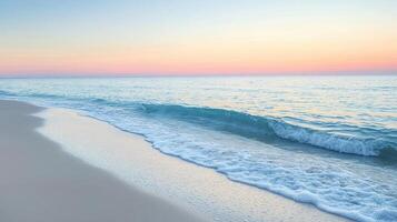 A serene beach at sunset, showcasing gentle waves and soft sand photo