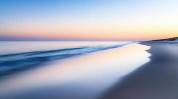 A serene beach at sunset, with gentle waves and a calm atmosphere photo