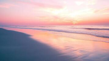 A serene beach at sunset, with gentle waves reflecting soft pink hues in the sky photo