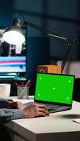 Vertical Self employed person checking financial graphs on chroma key screen, researching and sharing insight. Remote worker comparing business graphic economic figures, creating a strategy. Camera B. video