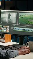 Vertical maker producing montage with artistic software for color adjustment, special effects in movie editing. Digital media illustrator developing transitions for cinematic production. Camera B. video
